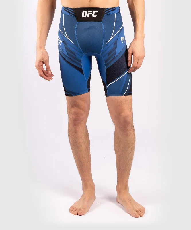 Men's ripped denim shorts for a trendy streetwear aestheticShort de Vale tudo Homme UFC Venum Authentic Fight Night - Coupe Longue - Bleu Men's ripped denim shorts for a trendy streetwear aestheticShort de Vale tudo Homme UFC Venum Authentic Fight Night - Coupe Longue - Bleu