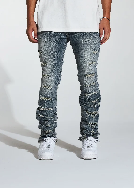 Men's Distressed Jeans with Patches for a Retro and DIY - Inspired AppearanceFray Stacked Flare Denim (Indigo) Men's Distressed Jeans with Patches for a Retro and DIY - Inspired AppearanceFray Stacked Flare Denim (Indigo)