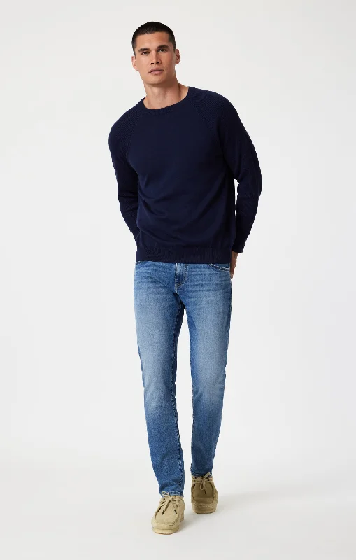 Men's Cargo Jeans with Multiple Pockets for a Practical and Outdoor - Friendly LookJAKE SLIM LEG IN MID BRUSHED NASHVILLE Men's Cargo Jeans with Multiple Pockets for a Practical and Outdoor - Friendly LookJAKE SLIM LEG IN MID BRUSHED NASHVILLE