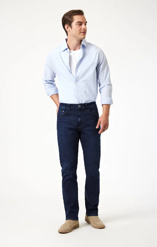 Men's Distressed Jeans with Patches for a Retro and DIY - Inspired AppearanceZACH STRAIGHT LEG IN MIDNIGHT BRUSHED SUPERMOVE Men's Distressed Jeans with Patches for a Retro and DIY - Inspired AppearanceZACH STRAIGHT LEG IN MIDNIGHT BRUSHED SUPERMOVE