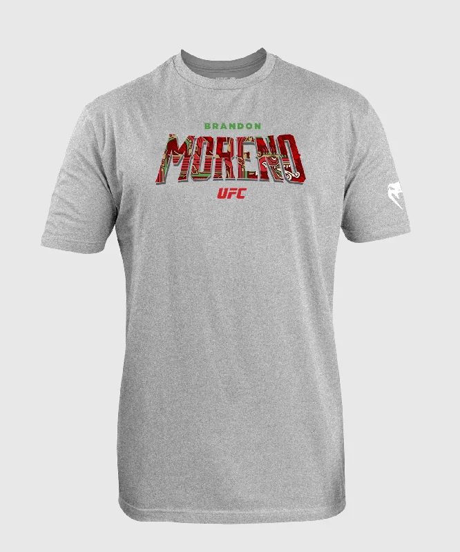 Men's v - neck muscle t - shirts for a body - building aestheticUFC Unrivaled by Venum Brandon Moreno Men’s T-Shirt - Heather Grey Men's v - neck muscle t - shirts for a body - building aestheticUFC Unrivaled by Venum Brandon Moreno Men’s T-Shirt - Heather Grey